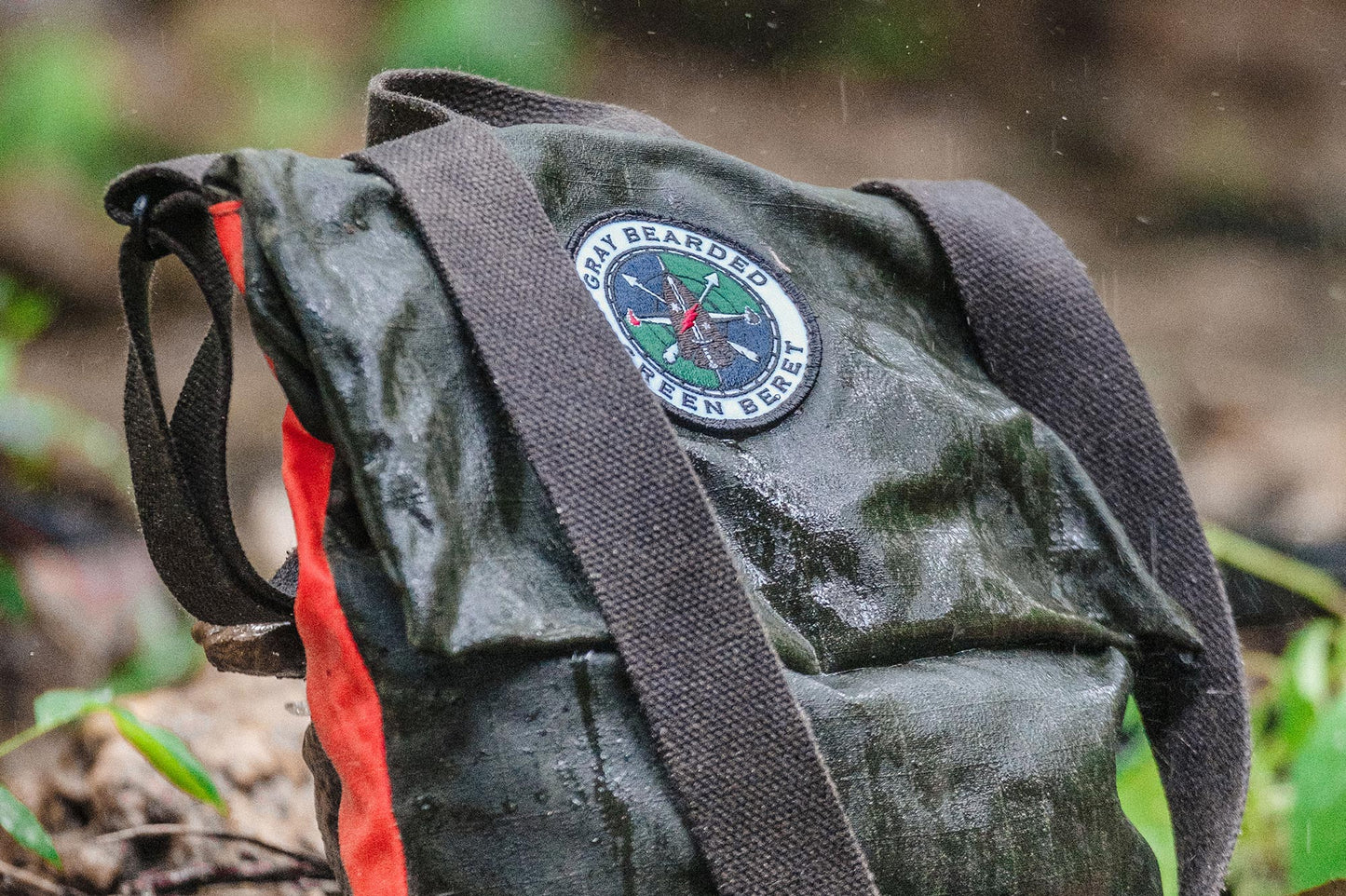 GB2 Waxed Canvas Haversack with Adjustable Strap in rain storm side view