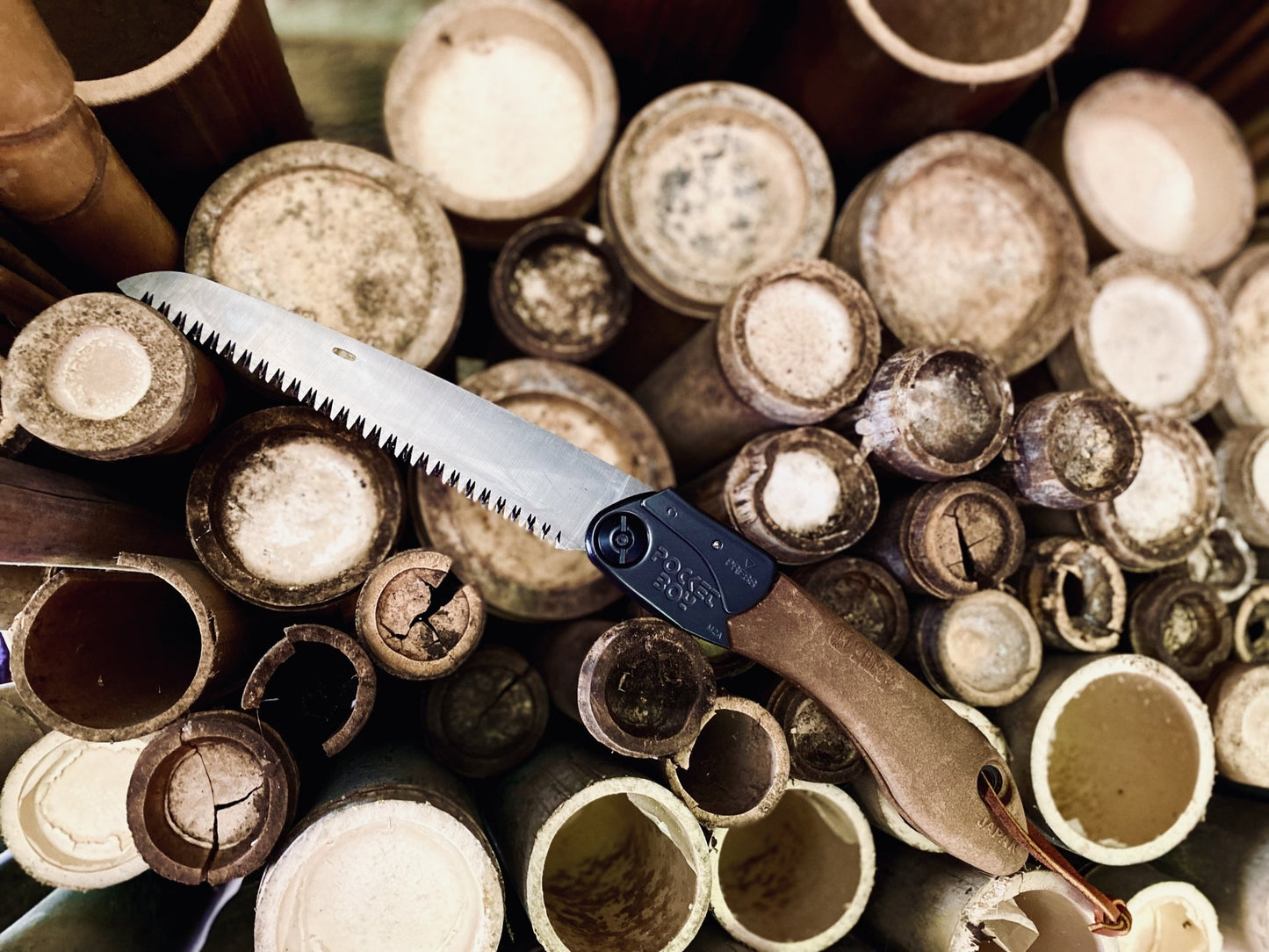 Silky PocketBoy Outback Edition Folding Saw: The Ultimate Outdoor Cutting Tool Fully Open on Bamboo