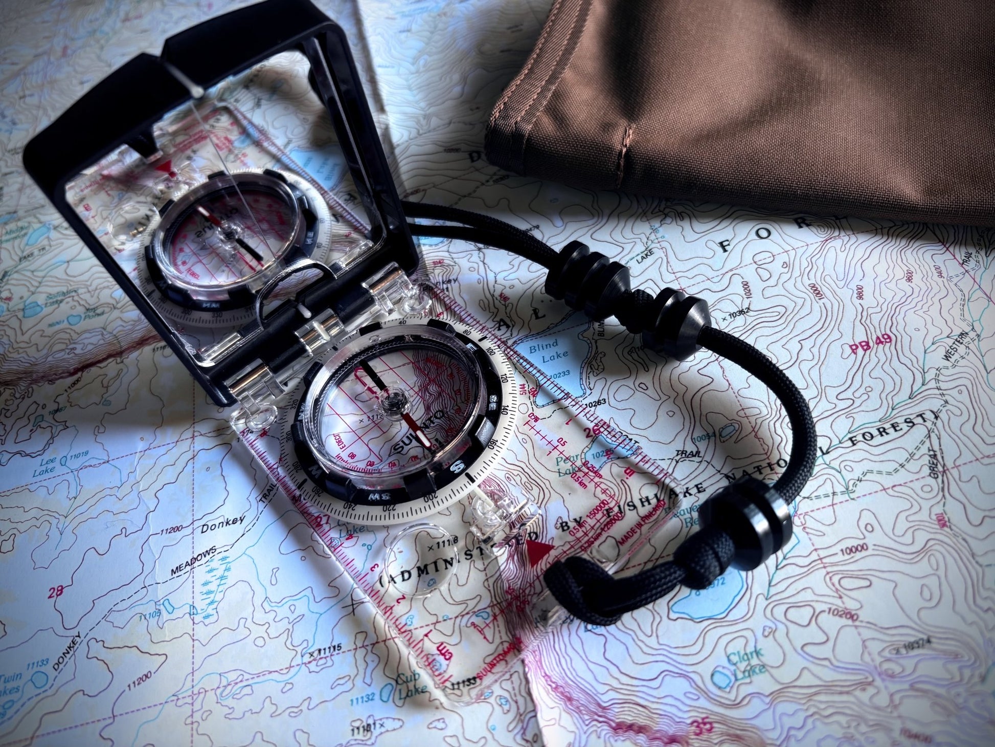 Compass on a map with GB2 Ranger Beads