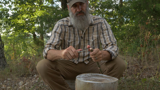 Carving a tent stake with a survival knife — field knife skills demonstration