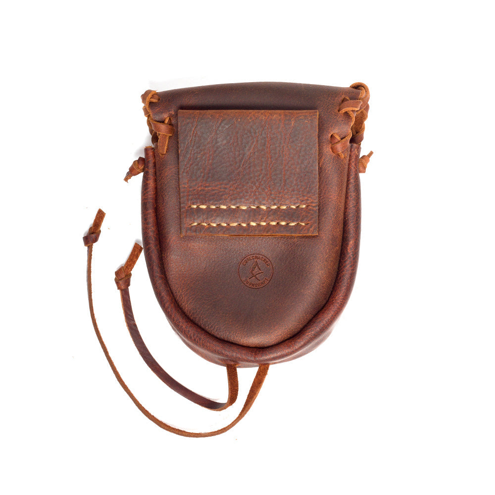 Leather pouch with white background and antler fastener closed back view