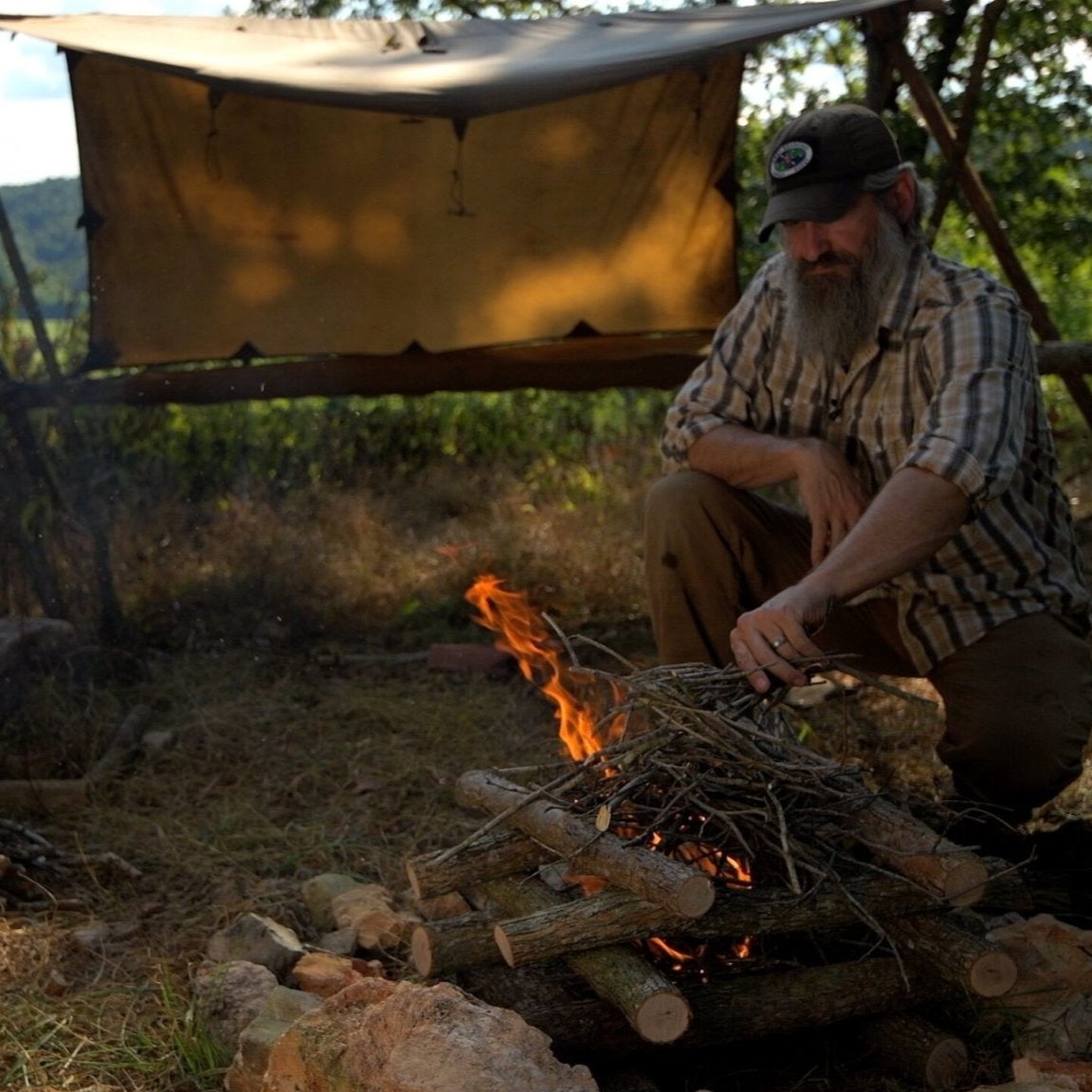 Bushcraft Skills Course - Gray Bearded Green Beret Survival School - Log Cabin Fire Lay with Tripod Raised Bed and Tentsmiths Oilskin Tarp