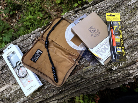 Custom Map Reading and Land Navigation Kit Bundle on log in forest