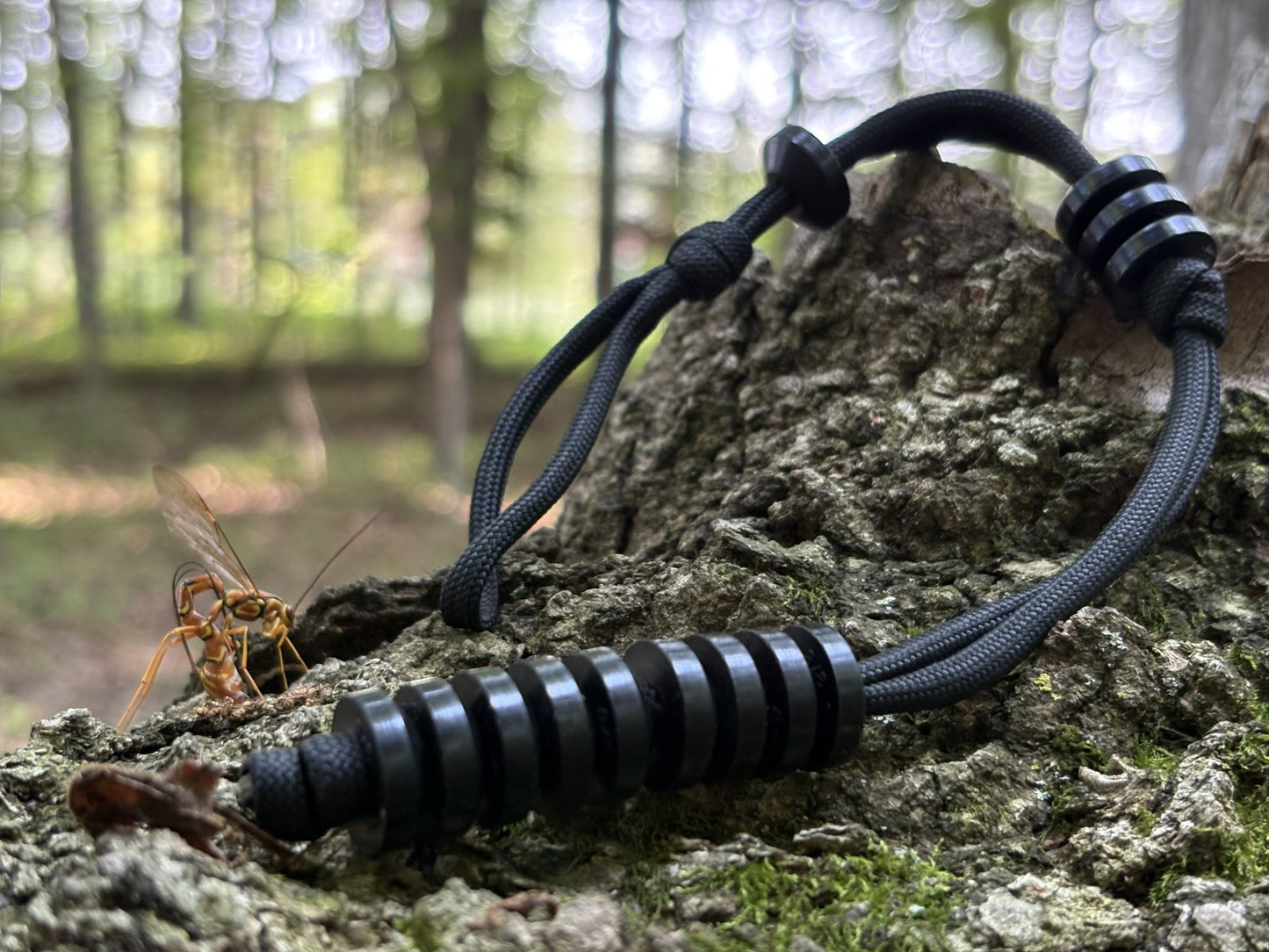 GB2 Ranger Pace Counter: Accurate Manual Distance Tracking Tool for Land Navigation on log with wasp