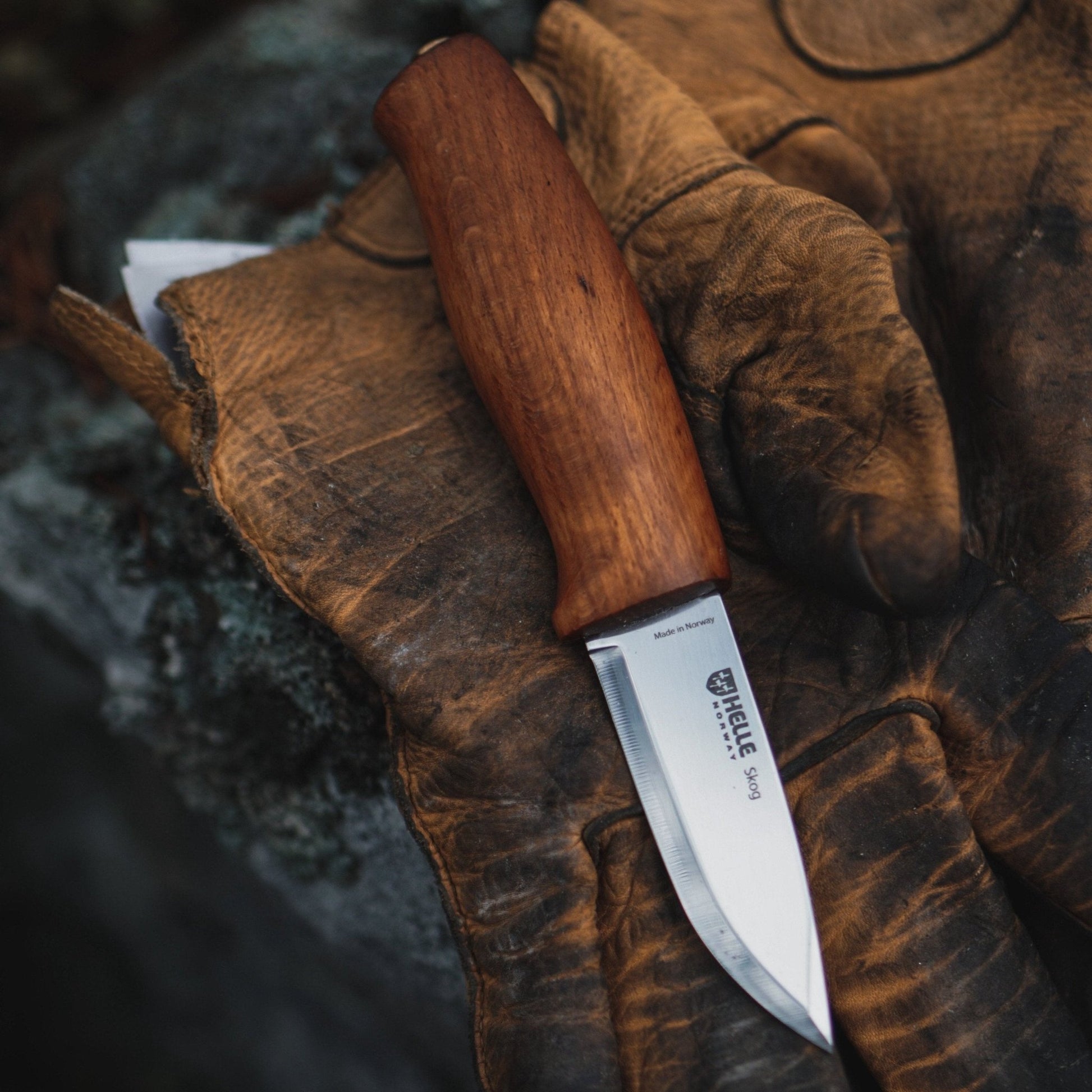 Helle Skog Fixed Blade Carving Knife on gloves