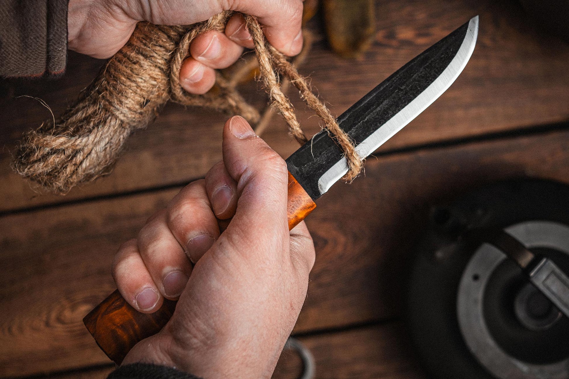 Helle Viking Fixed Blade Knife in use cutting cordage