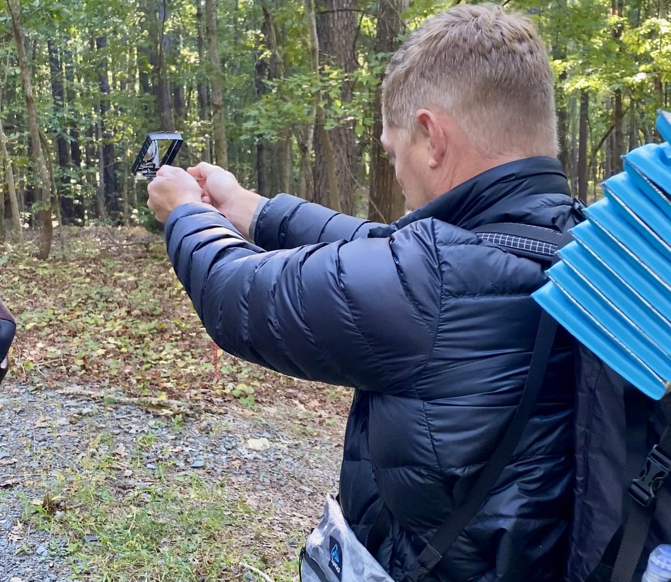 Master Navigator Land Navigation Course — Gray Bearded Green Beret Survival School Student Shooting Azimuth with Compass in Field