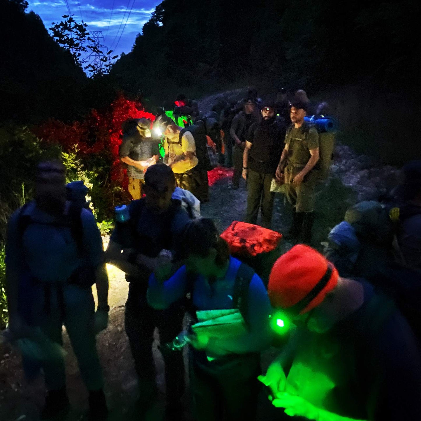 Master Navigator Land Navigation Course — Gray Bearded Green Beret Survival School Students Night Navigation with Headlamps and Glow Sticks