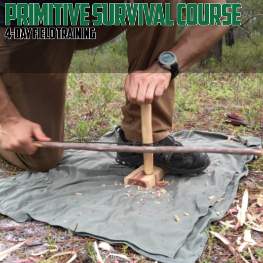 Person in a primitive survival course using BOW DRILL on a green mat outdoors.