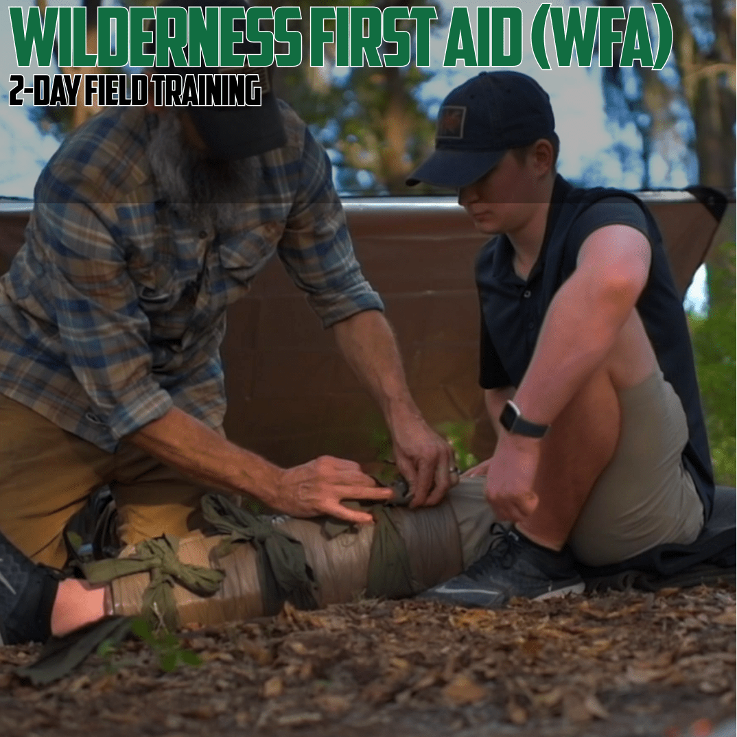 Two people performing a first aid procedure outdoors with 'Wilderness First Aid (WFA) 2-Day Field Training' text.