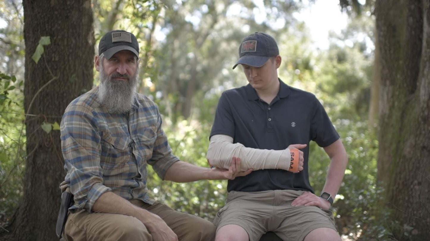Joshua and student with SAM splint forearm wrap during wilderness first aid training