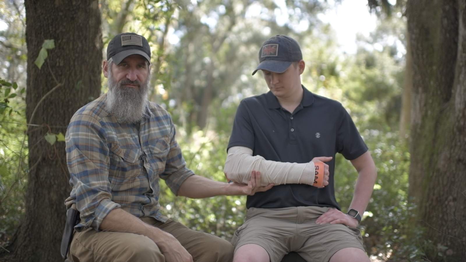 Joshua and student with SAM splint forearm wrap during wilderness first aid training