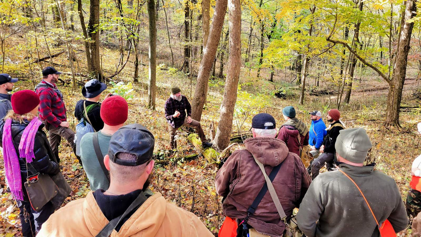 Wilderness Survival Course — Gray Bearded Green Beret Survival School Students and Instructor Field Instruction in Autumn Woodland
