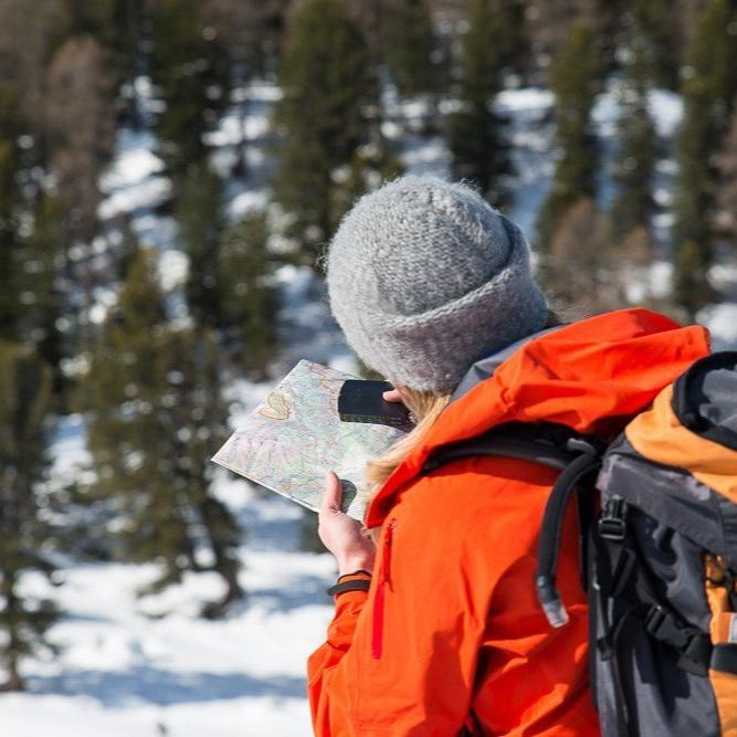 Winter Survival Course - Gray Bearded Green Beret Survival School Woman on Land Navigation Lane Reading Map holding Suunto MC2 Compass