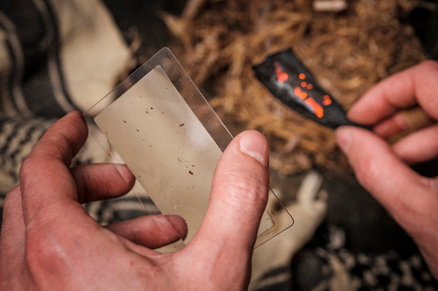 fresnel lens magnifier wallet-sized fire starter in use