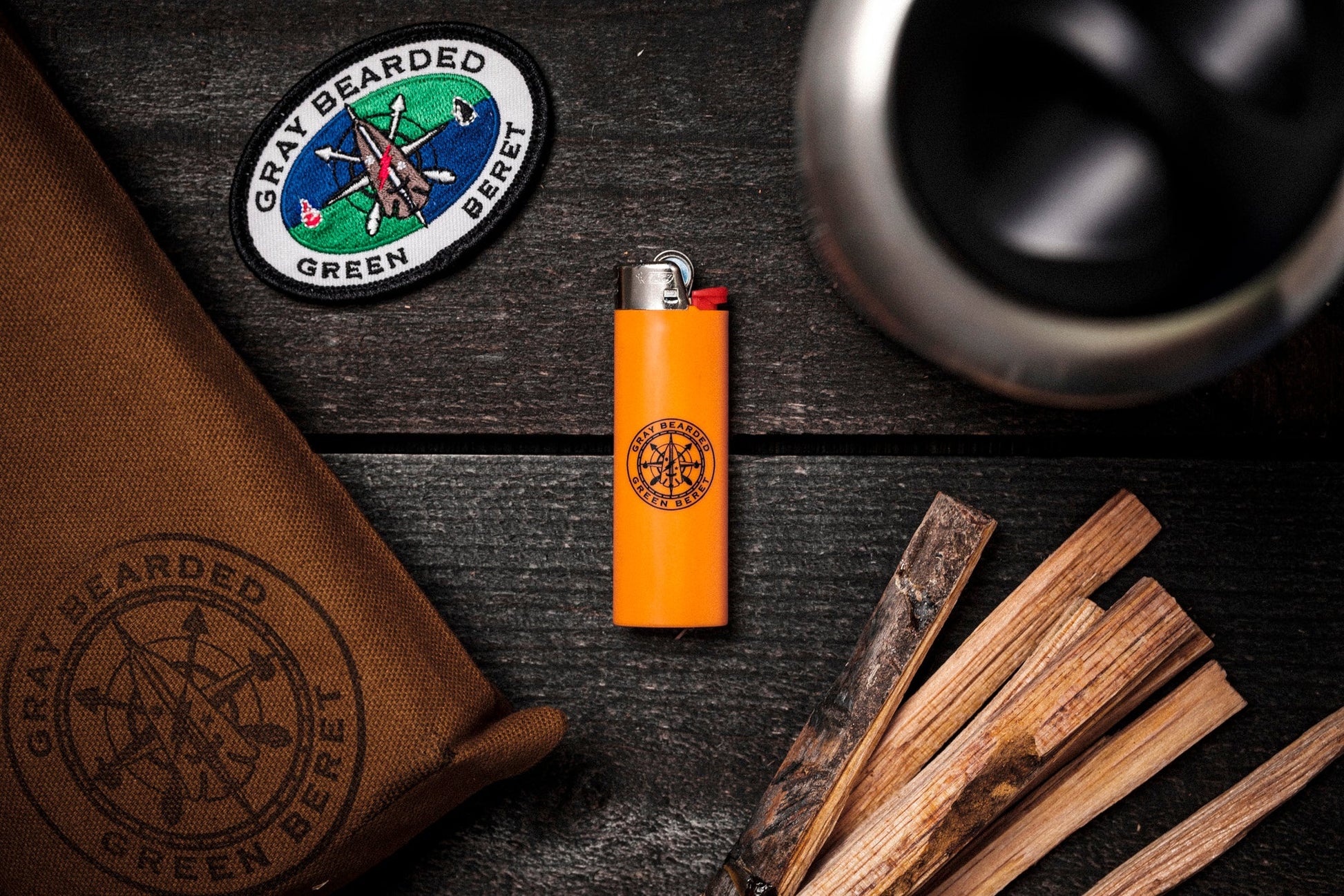 GB2 high visibility orange custom logo bic lighter flat lay