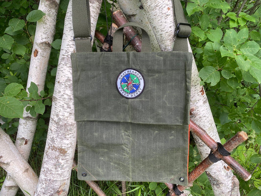 Waxed Canvas Haversack with Adjustable Strap Hanging on White Birch