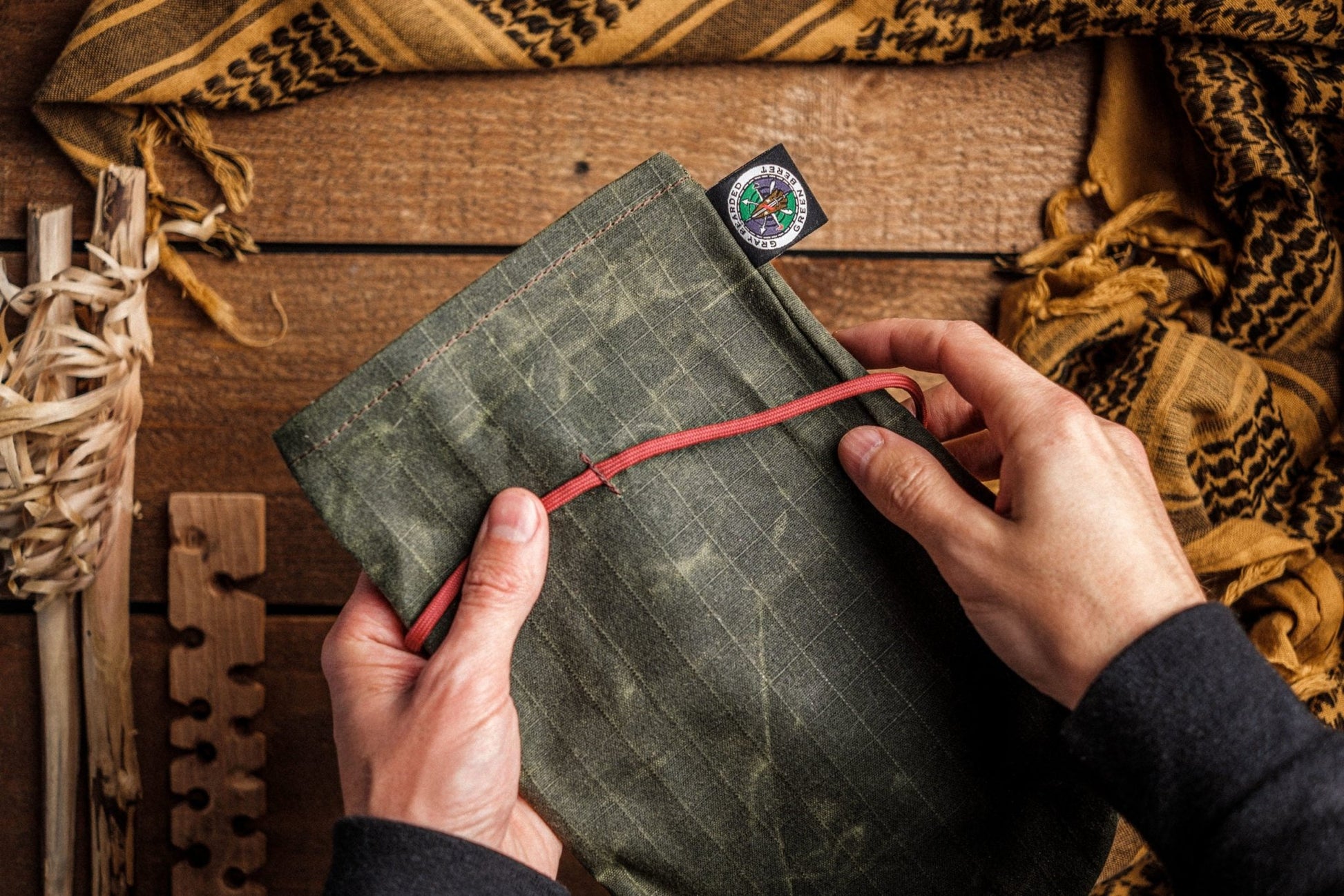 Waxed Canvas Tinder Pouch with Secure Tie Closure in Hand